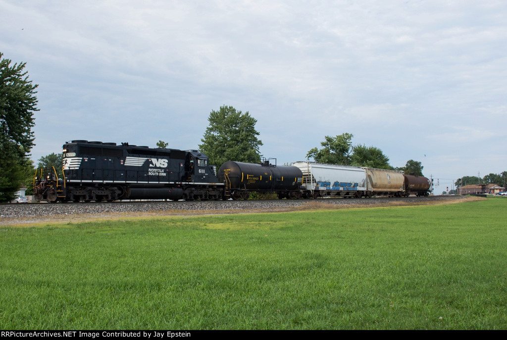 NS 6111 leads a local west