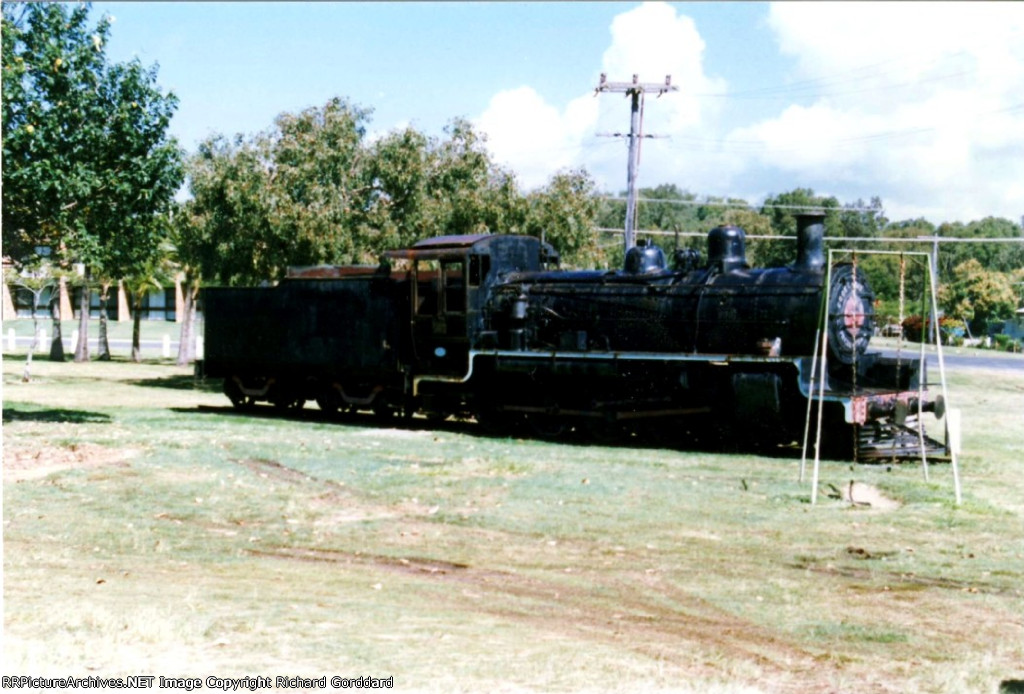 Old steam locomotive in a park near the beach