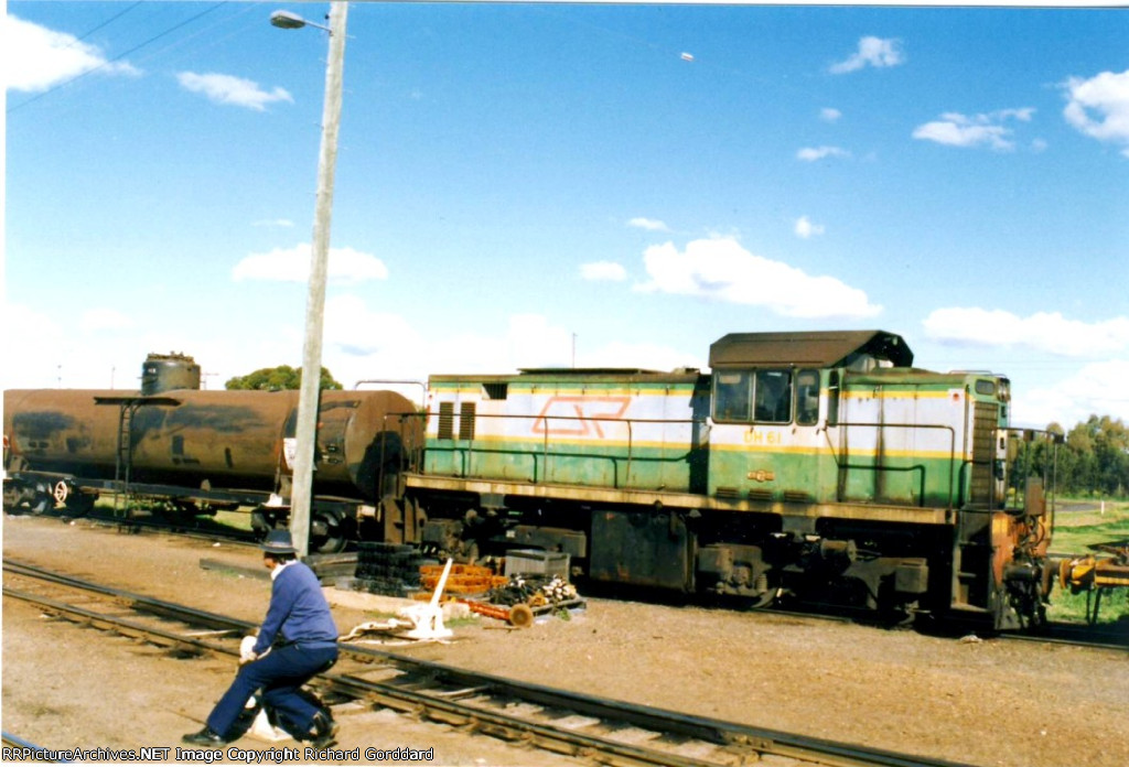 Holding down a spring switch 