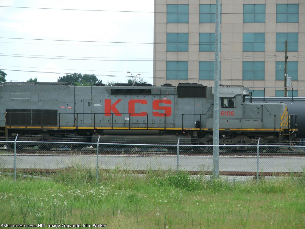 KCS 6106 with Airline Highway buildings in bachground