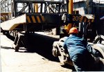 Rolling the truck under the flat car