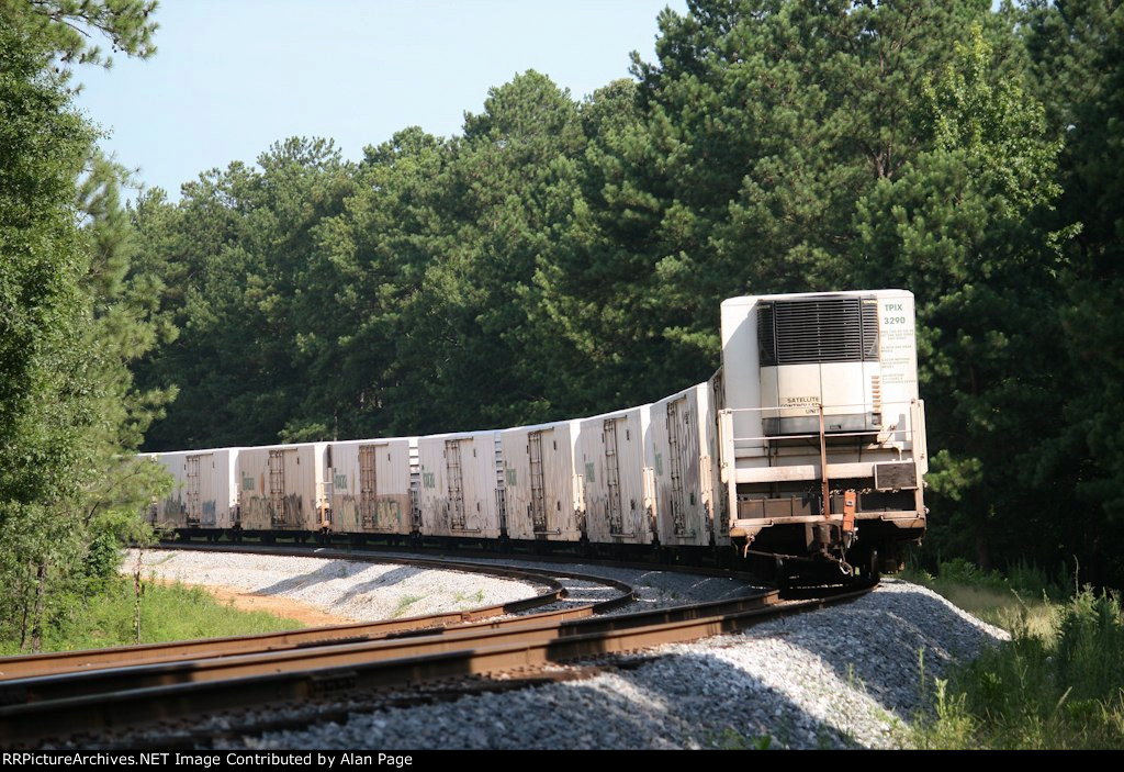 TPIX 3290 at the tail end of a line of Tropicana reefers heading NB