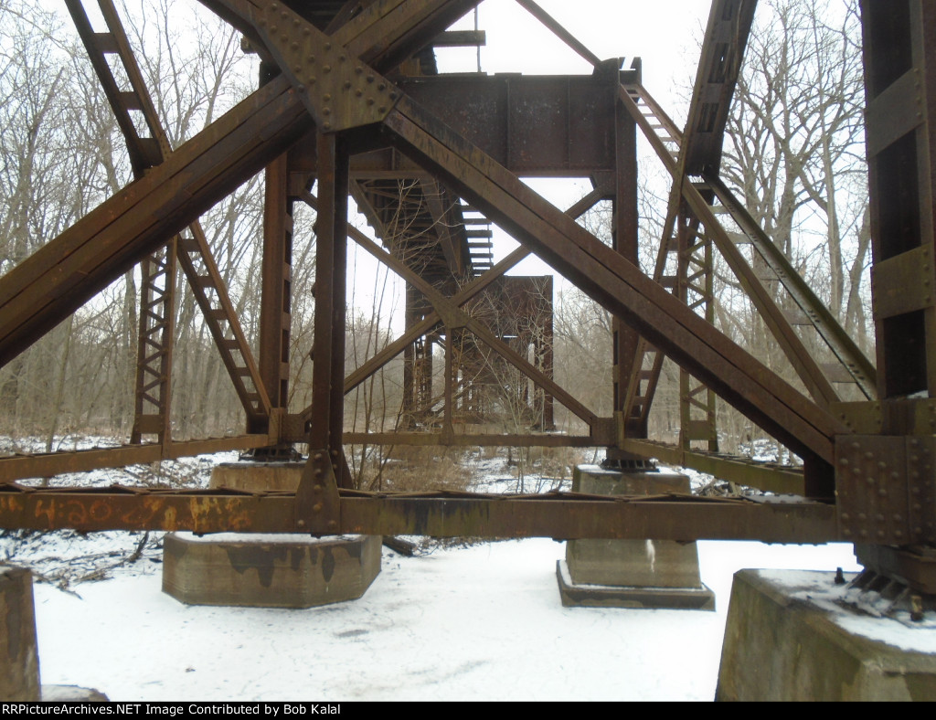 after climbing down embankment, got under the trestle
