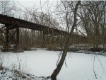 after climbing down embankment, got under the trestle