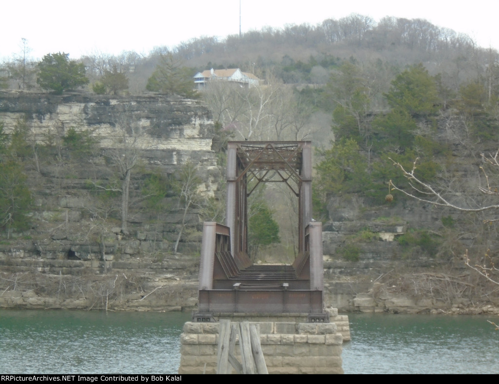 Trestle with rock cut across the river that was named the narrows