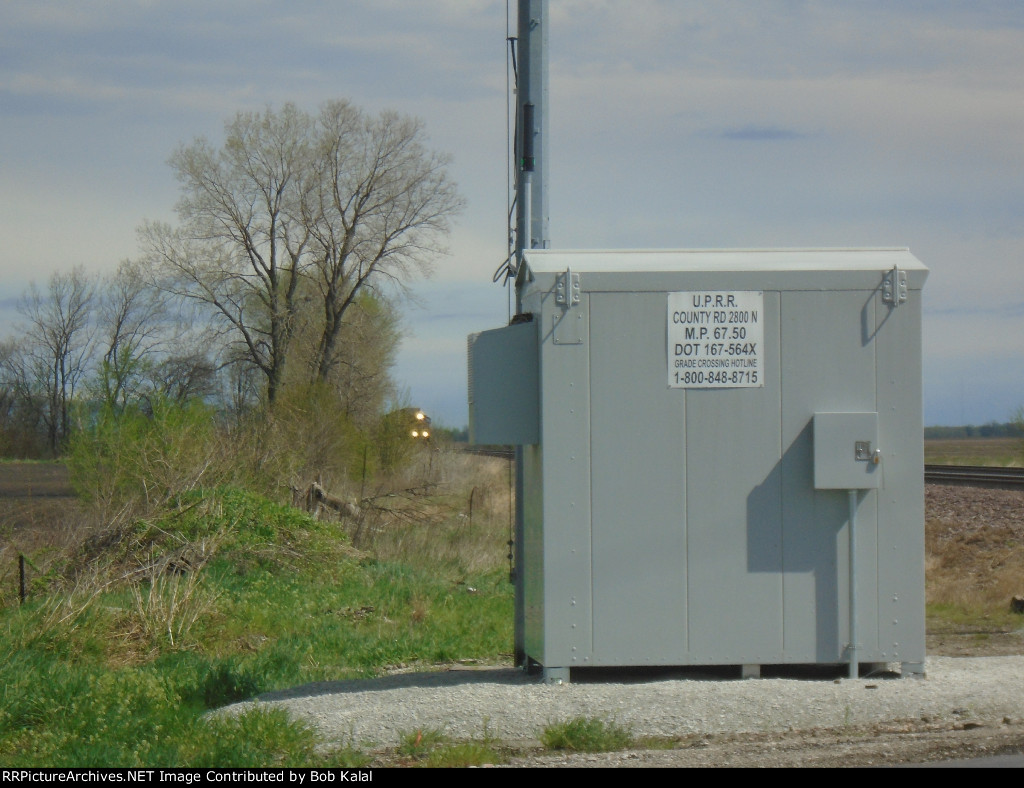 Looking North at Electrical Box & Southbound UP 5107 & UP 8116