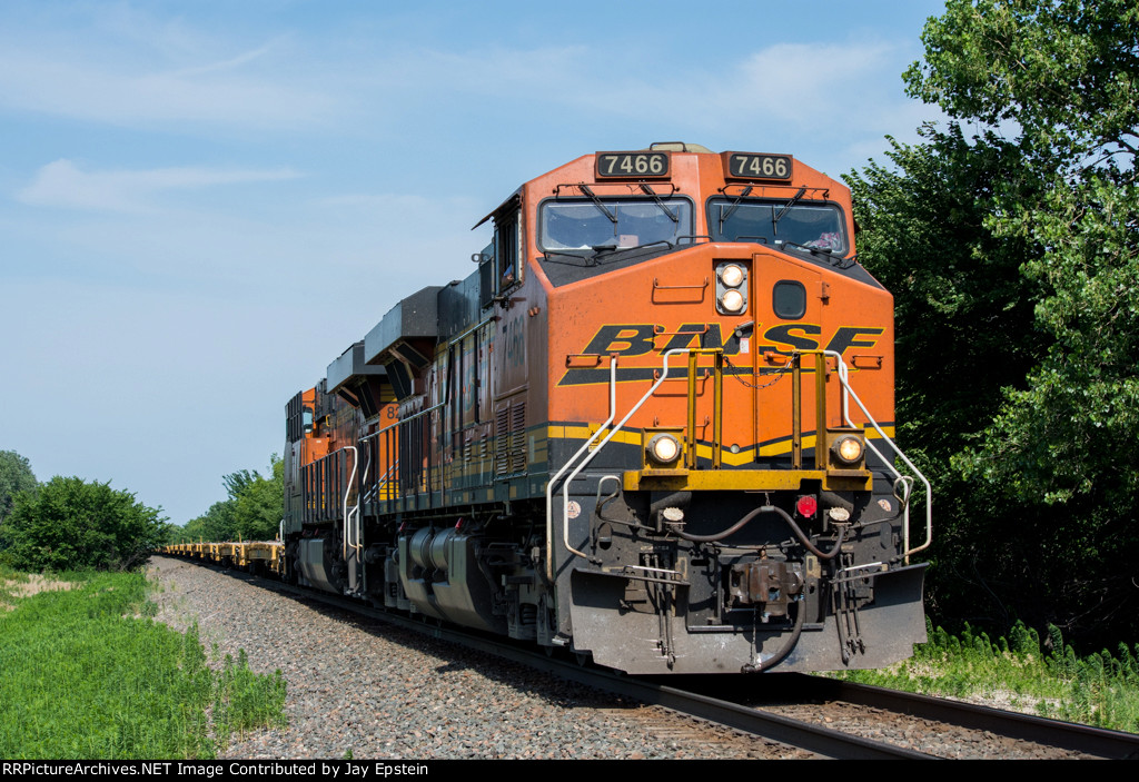 Two GE's lead an empty military train west 