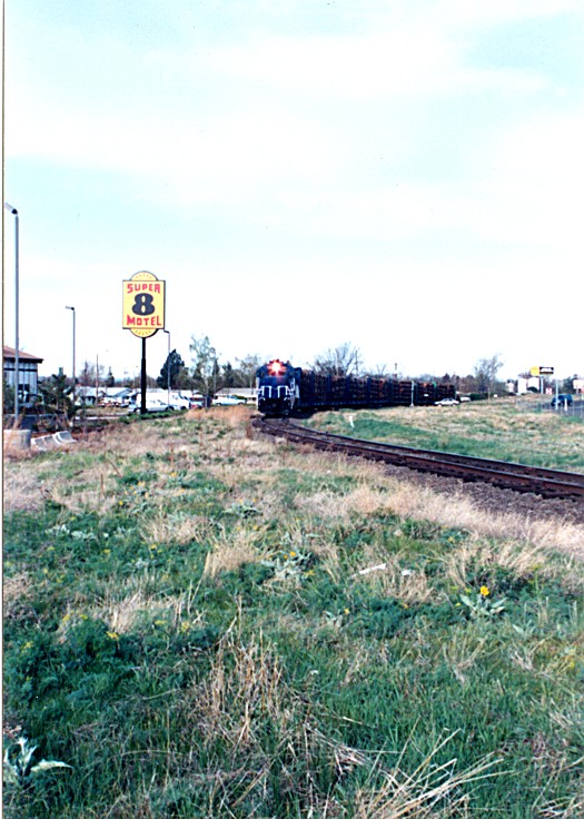 BMRR log train rolling by the super 8