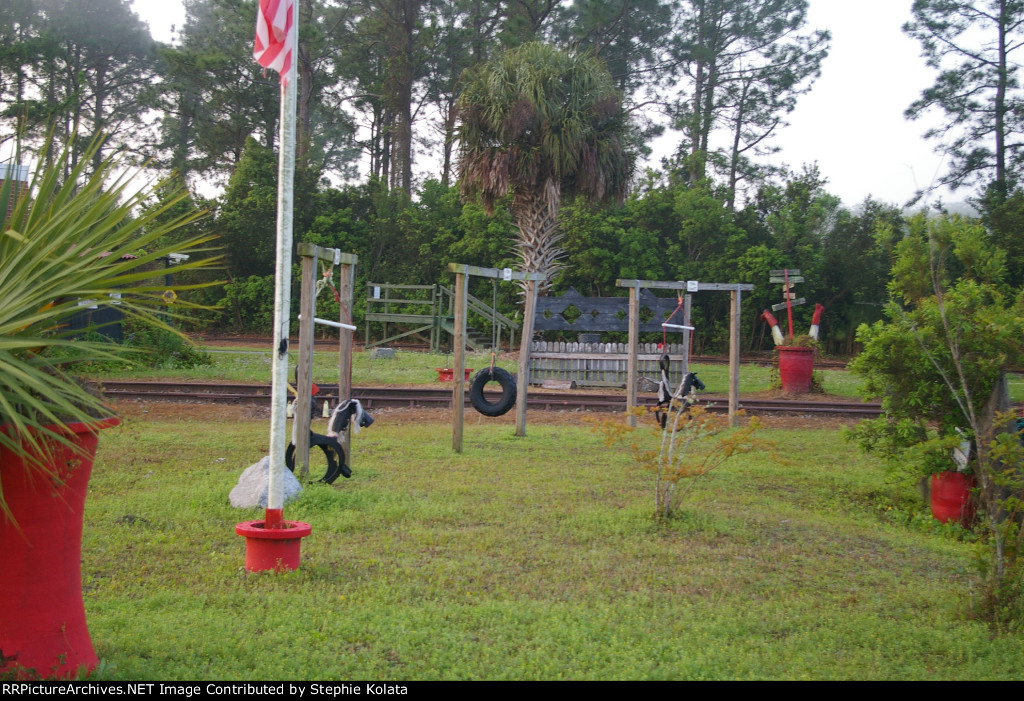 SWING AT THE ENGINEHOUSE BY THE TRACKS