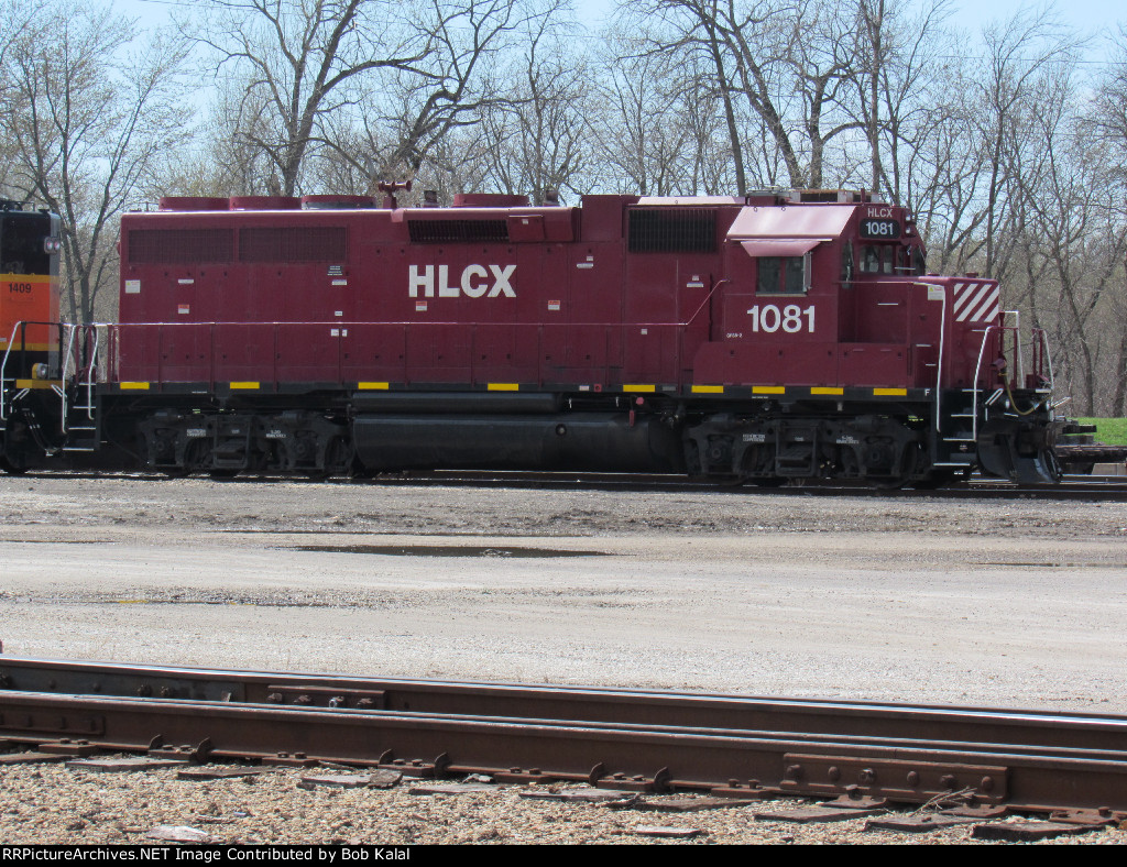 HLCX 1081 (ex-DRGW 3078) sitting in yard with BNSF 1409