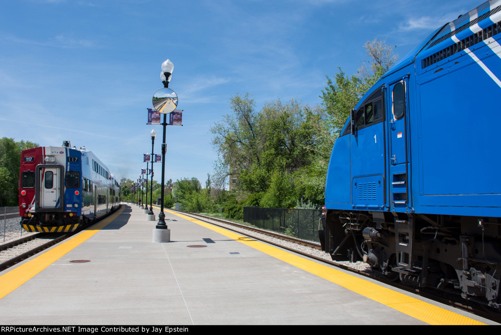 The northbound has the signal and heads out while the southbound slows to a halt