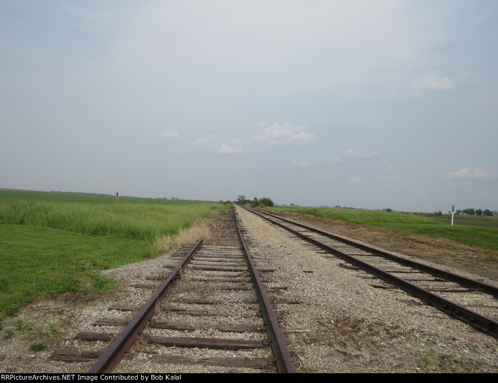 Looking East down NKP Tracks at Crossing East of Cheneyville Il. Cnty Rd 2000 E.