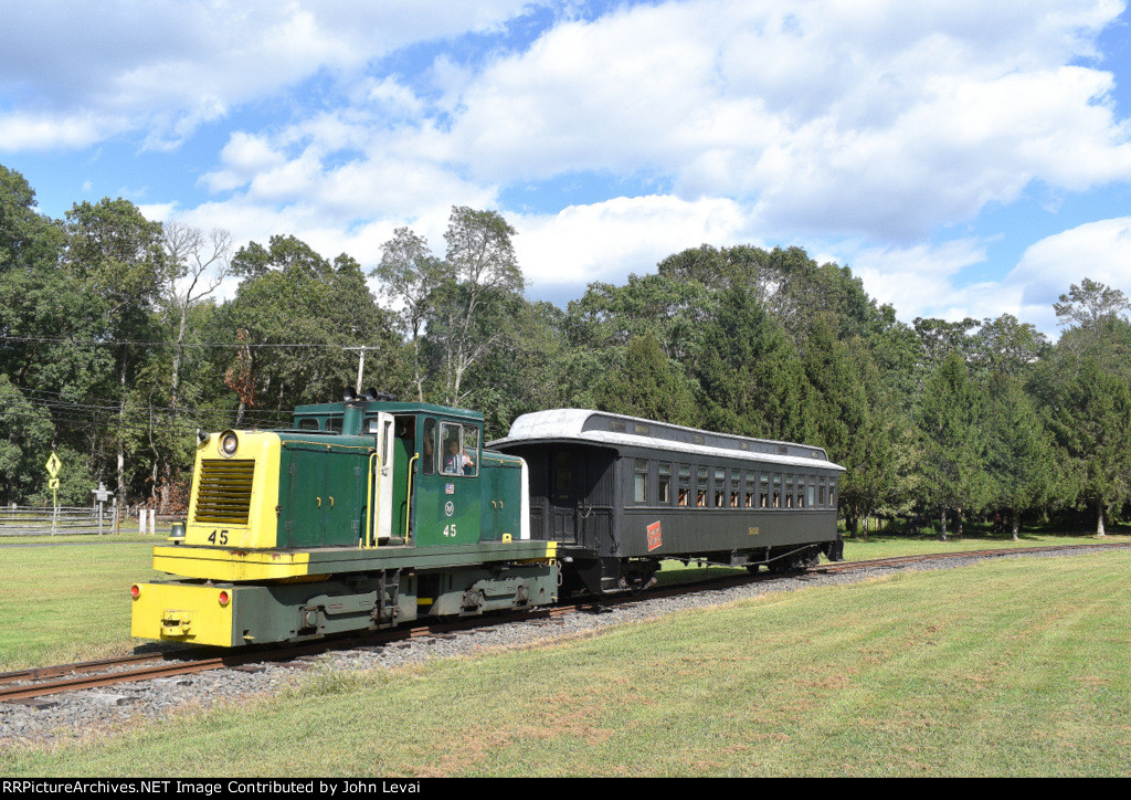 USS Tonner # 45 pulling its single restored elclosed CN Coach through the fields of Allaire State Park