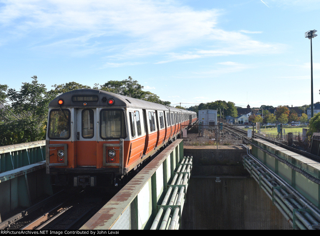 T Orange Line Train arriving into Malden Center Station heading to Oak Grove