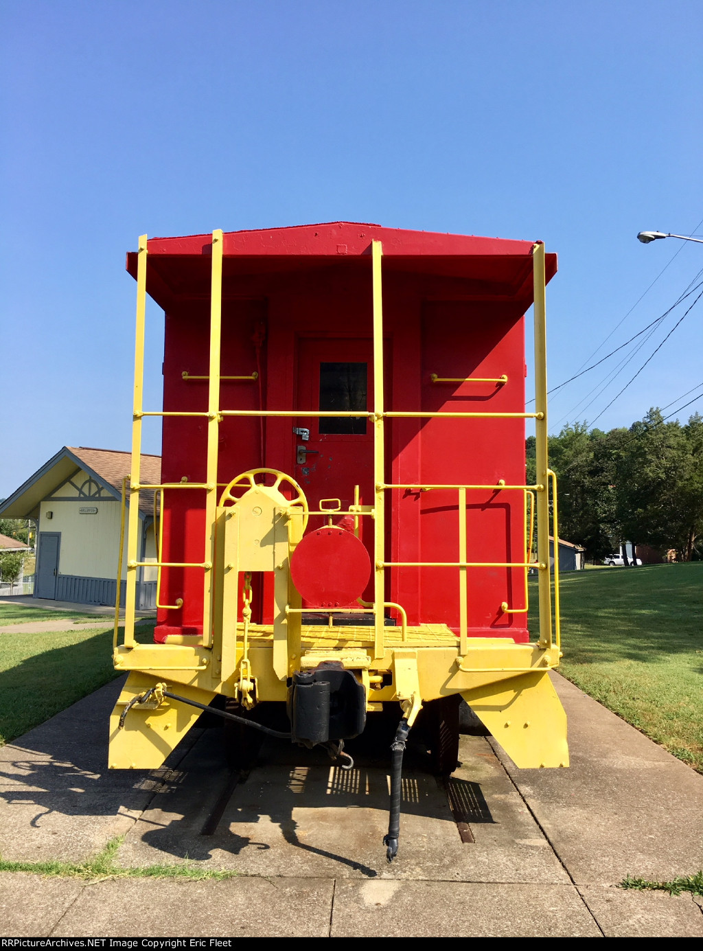 A red caboose L&N 136 at Bellevue Depot in the public park.