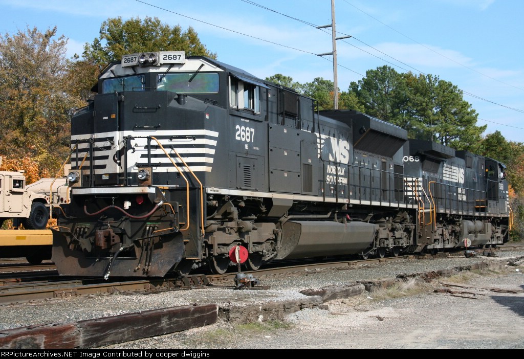 350s power backs to the engineshop past some new armored Humvees