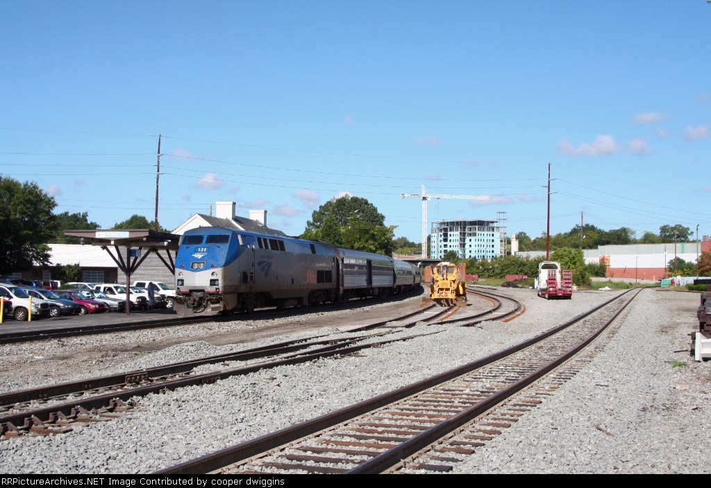 80 at the station, the new connection track is open, the old one is seen off to the right, and the sidings are almost complete