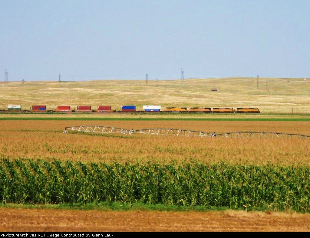 Taken through passenger window of my Big Rig while doing 70mph heading westbound on I-80 while the train is heading eastbound