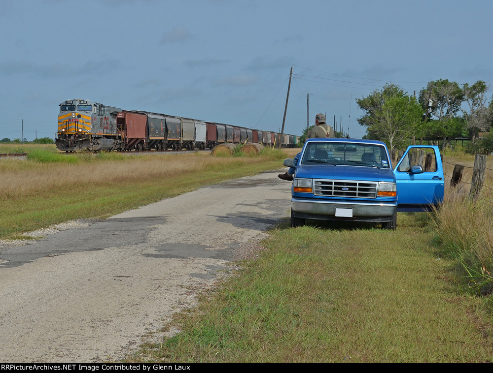 KCS 4616 leads a southbounder, my railfanning buddy and his chariot in the foreground