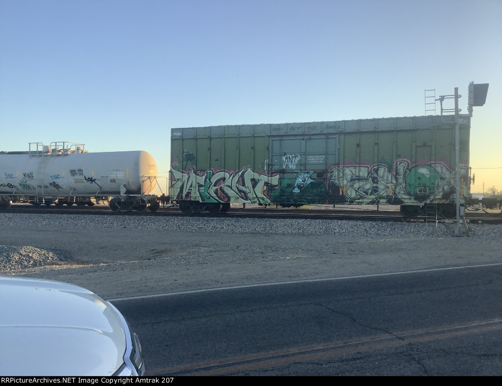 Green Laurinburg Southern Boxcar #97 Heads South at Niland 