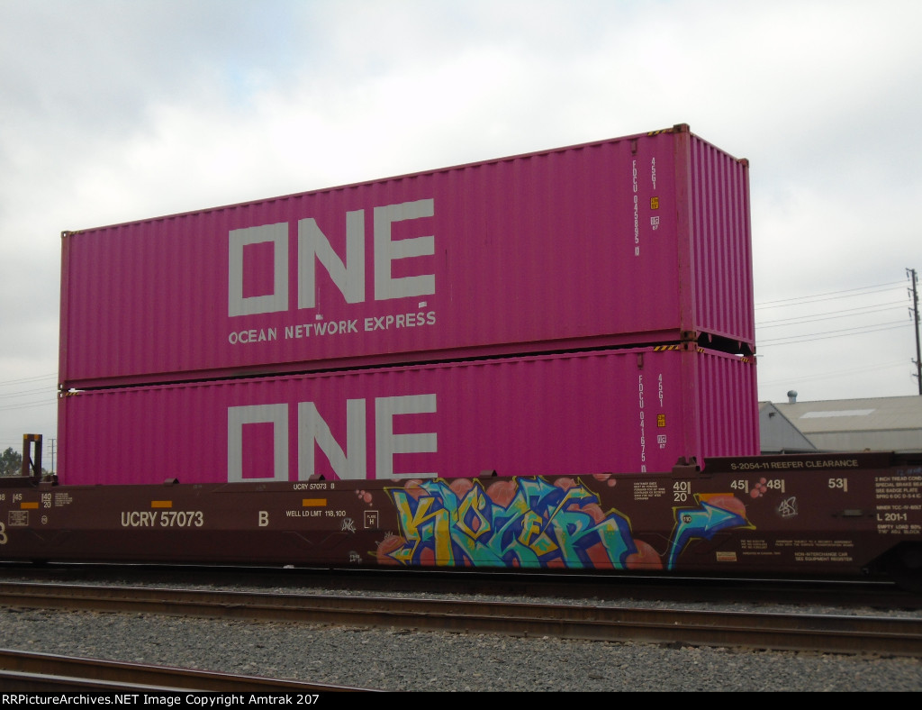 Two ONE Containers (#45895 and #41675) Passes Dolores Yard on a Utah Central Well Car 