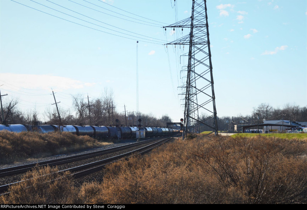 Tank Cars West and a Train Waiting East