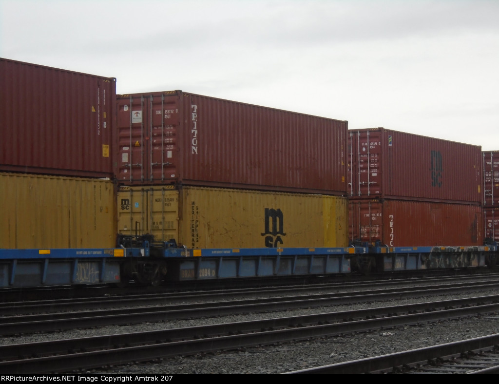 Triton Container #153712 and Mediterranean Shipping Co Container #825489 Wait for Offloading at Dolores Yard 