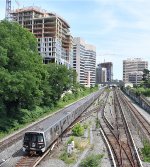 WMATA Metro 7K Series Train approaching Spring Street after having departed Silver Spring Station. The overpass in the background is part of the MTA Maryland Purple Line light Rail construction