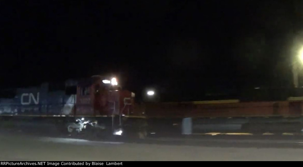 CN M335 passing BNSF coal train