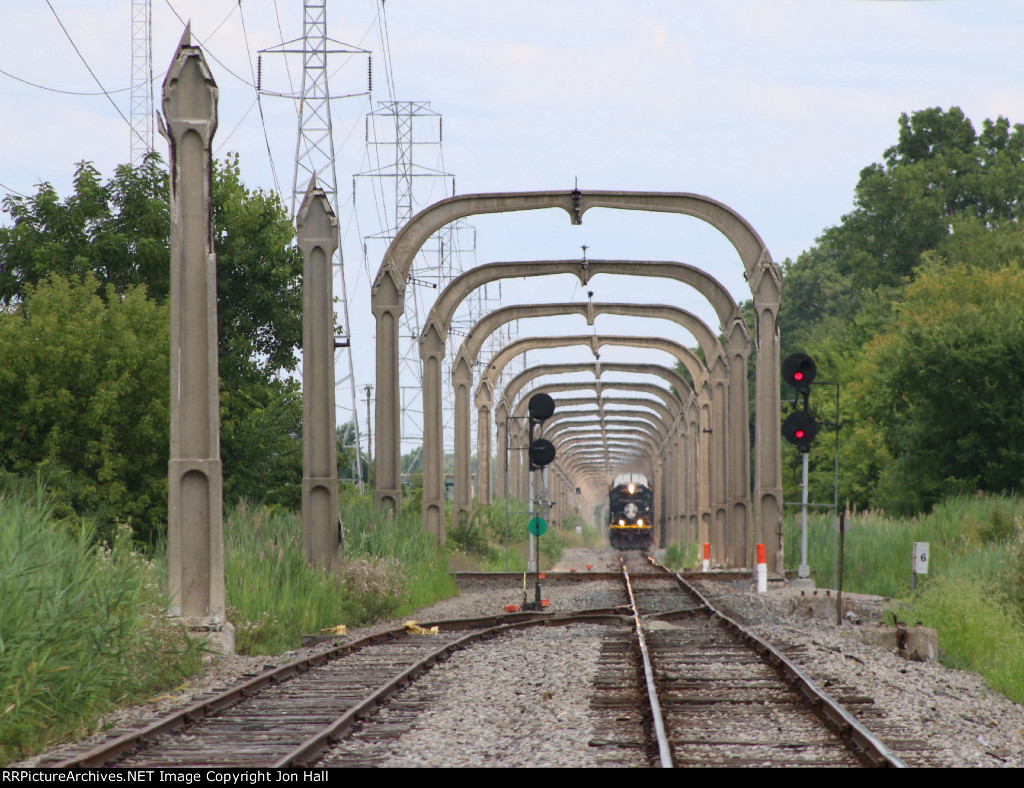 L572 approaches as it comes through the canopy of arches