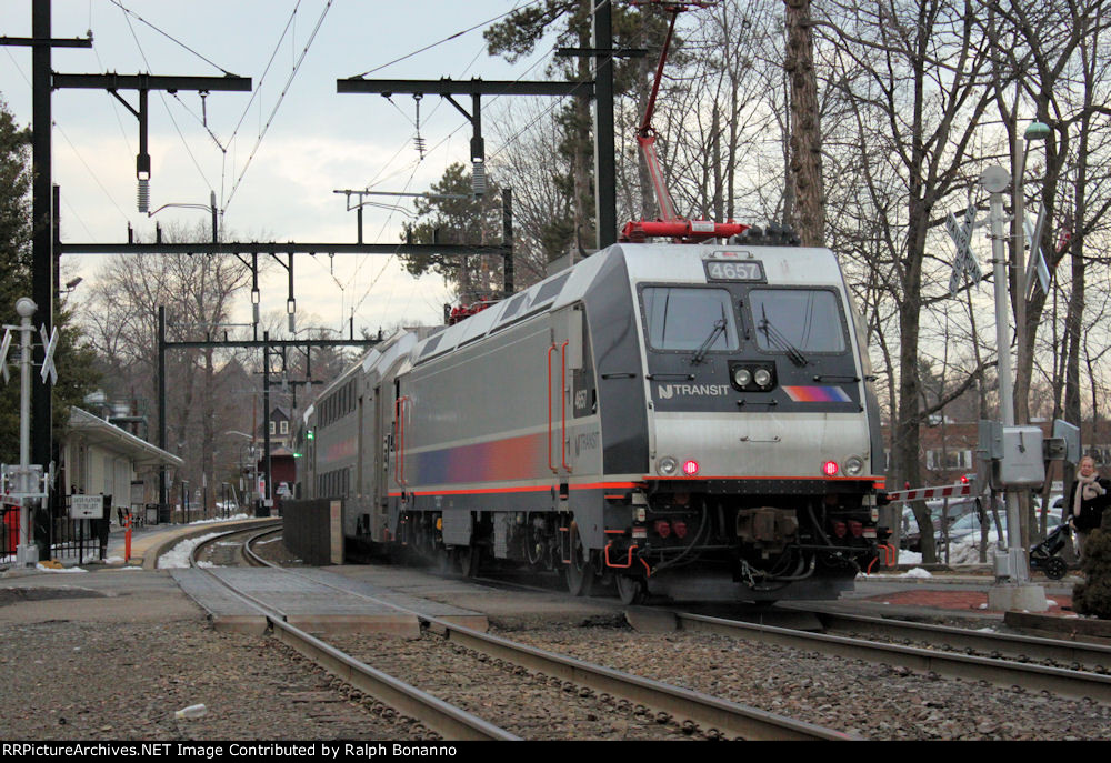 ALP-46A # 4657 shoves a westbound train  out of the station across Bellvue Ave