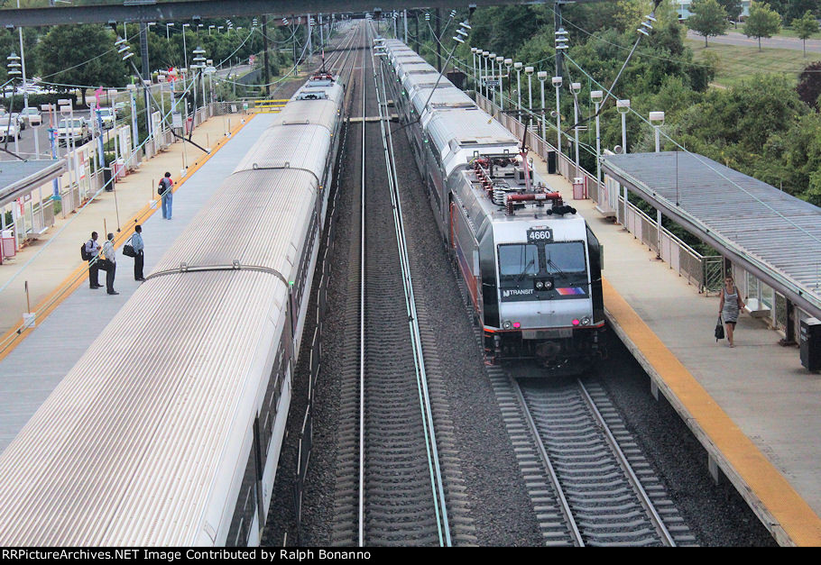Eastbound and westbound trains make a rush hour meet
