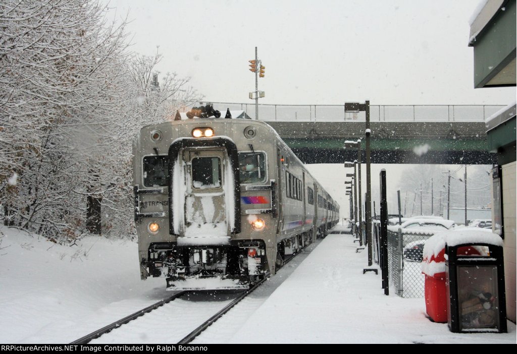Hoboken bound train # 1622 has this Comet V cab car in the lead as it stops in a mild snowfall