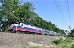 MNR GP40PH-2 # 4900 leads northbound NJT Train # 1165 along E. 55th St, running to Suffern