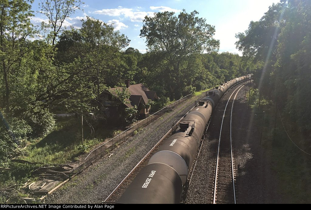A line of tank cars alongside the Valley Forge Park station