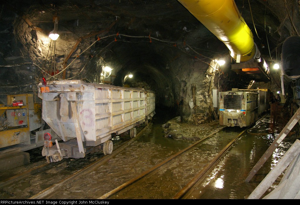 Empty much train and a "mantrip" waiting for the call