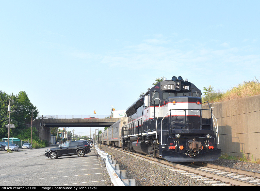 The 4101 in its NJDOT "Bluebird" colors shoving NJT Train 1612 past