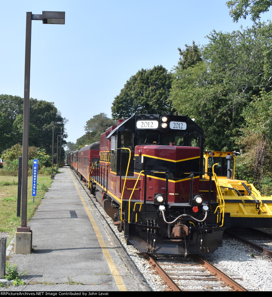 The 2012 leads the CCCR excursion train past the W. Barnstable Station back to Hyannis