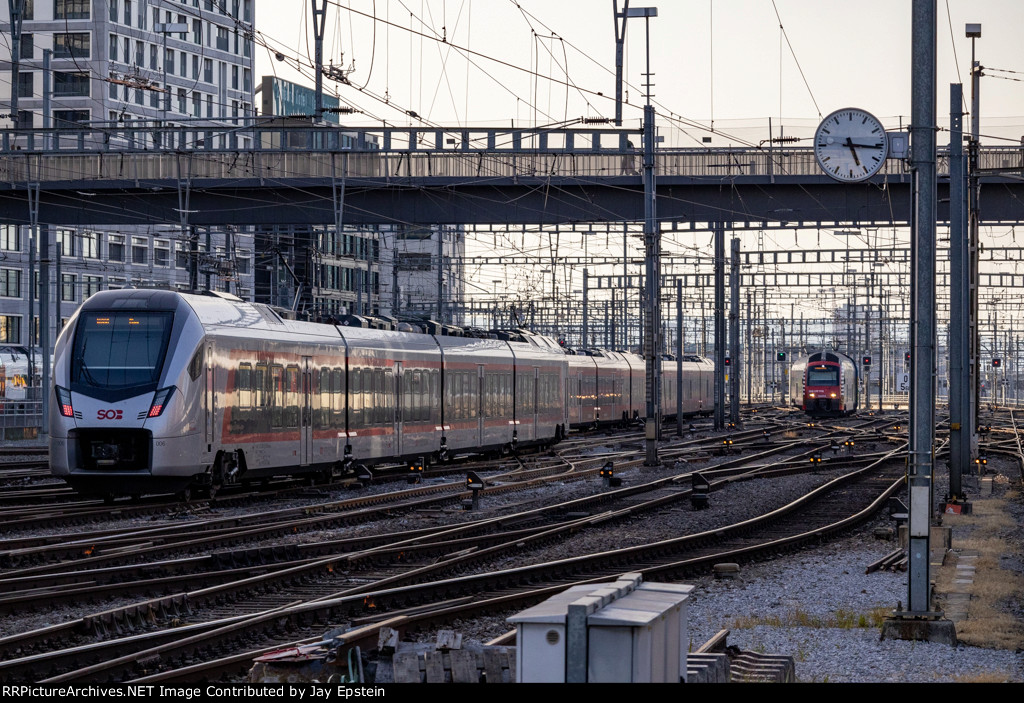 Two trains come into Zurich Hauptbahnhof in the late afternoon 