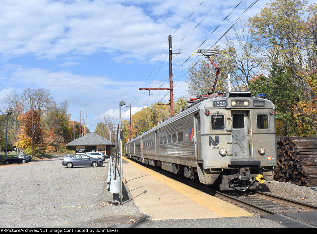 NJT Train # 724 departing Basking Ridge Station with Arrow III Cab Car # 1329 on the point.