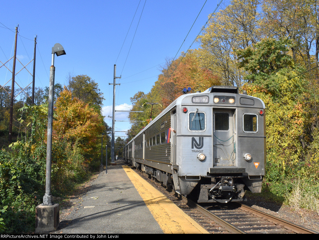 NJT Train # 726 approaching Basking Ridge depot with a lot of fall foliage in the background