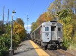 NJT Train # 726 approaching Basking Ridge depot with a lot of fall foliage in the background