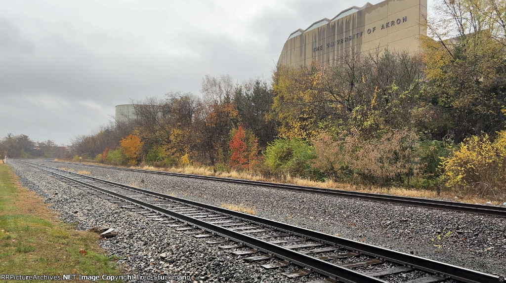 Soon it was silent except for the raindrops hitting the rails and ballast.
