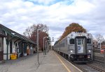 NJT Train # 76 races past the depot with a MNR Comet V Cab Car on the point