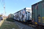 The boxcars that make up the train. The one with the camo colors of the Operation Toy Train Boxcar # 1947