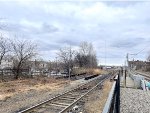 Conrail Shared Assets Bayonne Branch on the left and there is a freight yard in the background-foreground is 22nd St Station