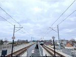 View is looking toward the end of the HBLRT trackage with a LR train in the background. In the past, there has been talk about extending the HBLRT line from Bayonne across the Bayonne Bridge into Port Richmond, Staten Island. Presently to go from Bayonne 