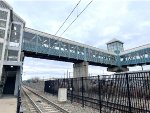 This pedestrian bridge is at the 34th Street HBLRT Station. It connects from the platform to the parking lot