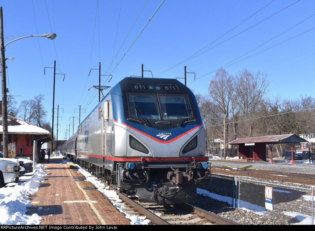 ACS-64 # 611 leads Eastbound Keystone Train # 664 into the station. 