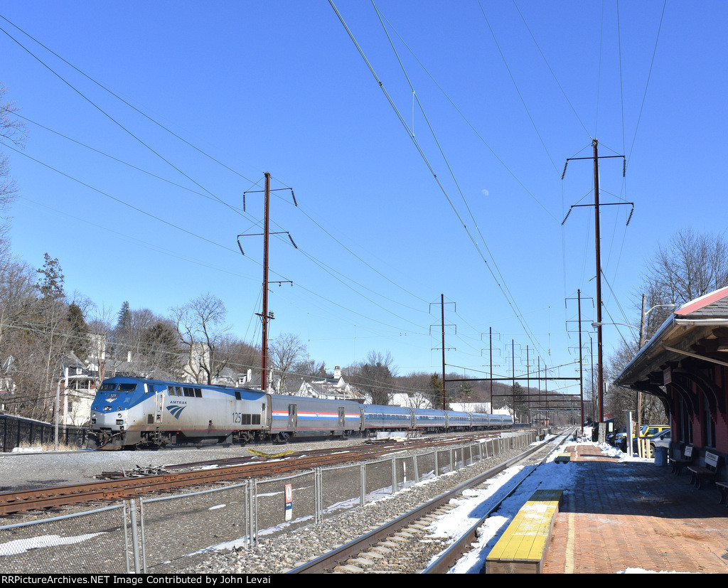 Amtrak Train # 43 heading west to Pittsburgh behind P42DC # 125 as it passes the Parkesburg Station. In the background is the Parkesburg Tower.